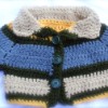 baby jacket/sweater; two snap closure on inside of lapel.
